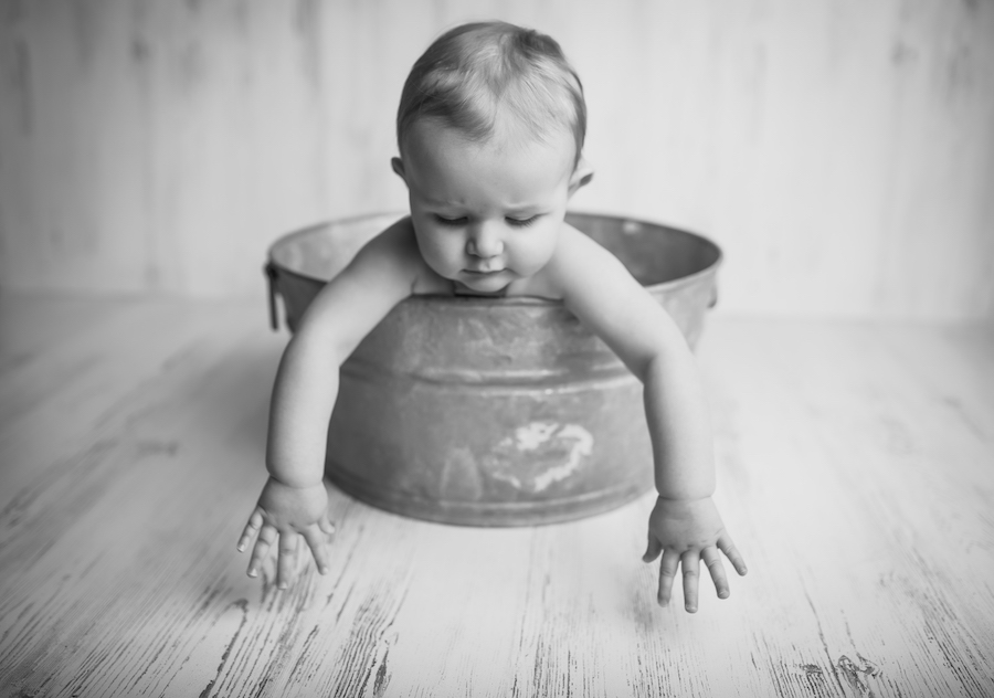 1 year old sitting in bucket