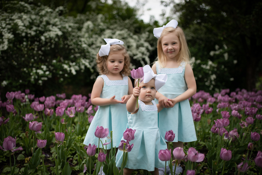 Sisters in purple tulips