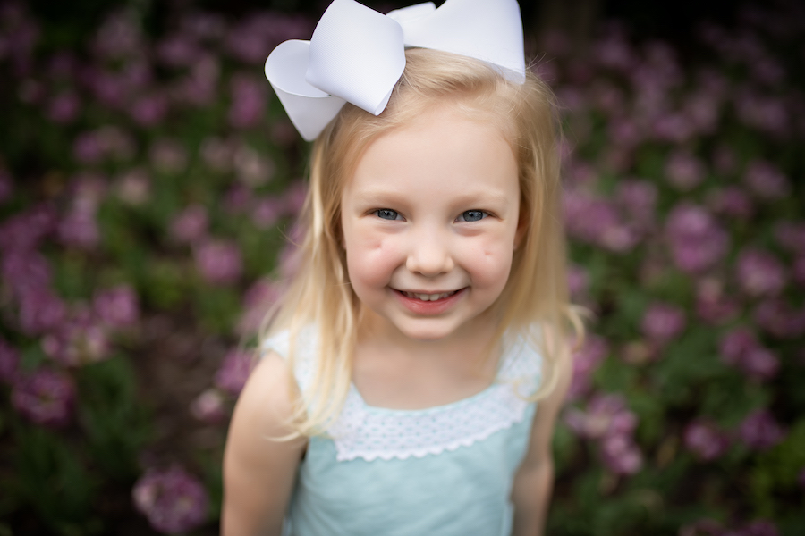 Girl smiling  with white bow