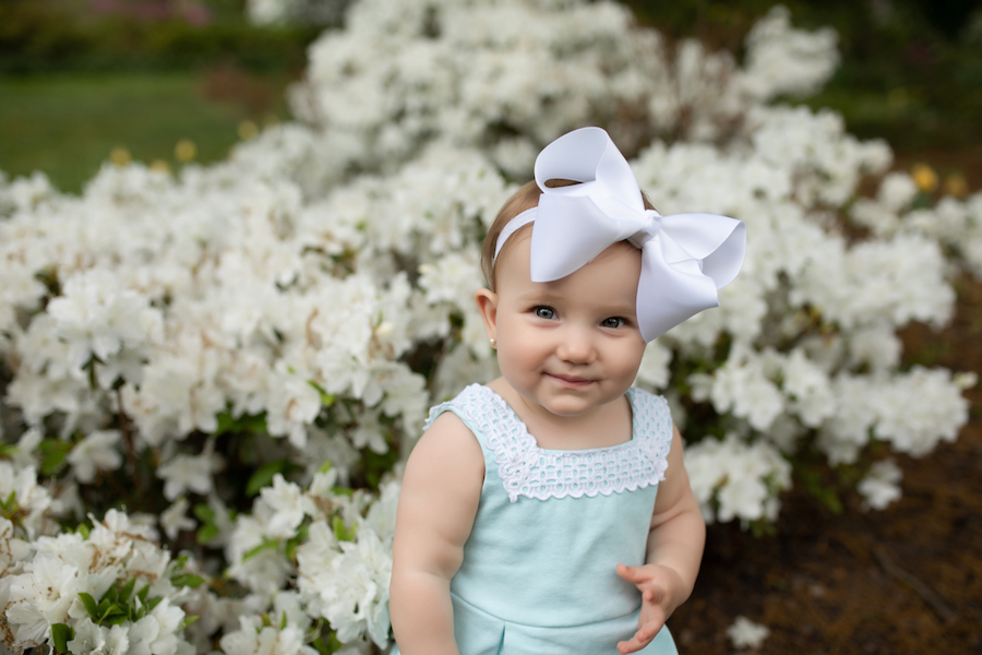 Baby with white bow