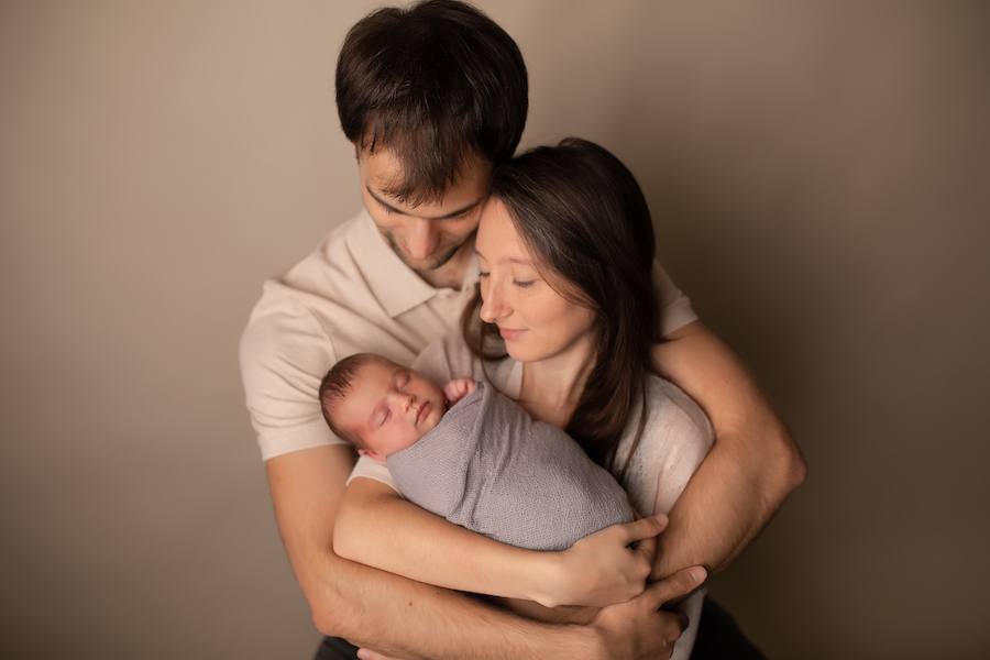Parents holding newborn