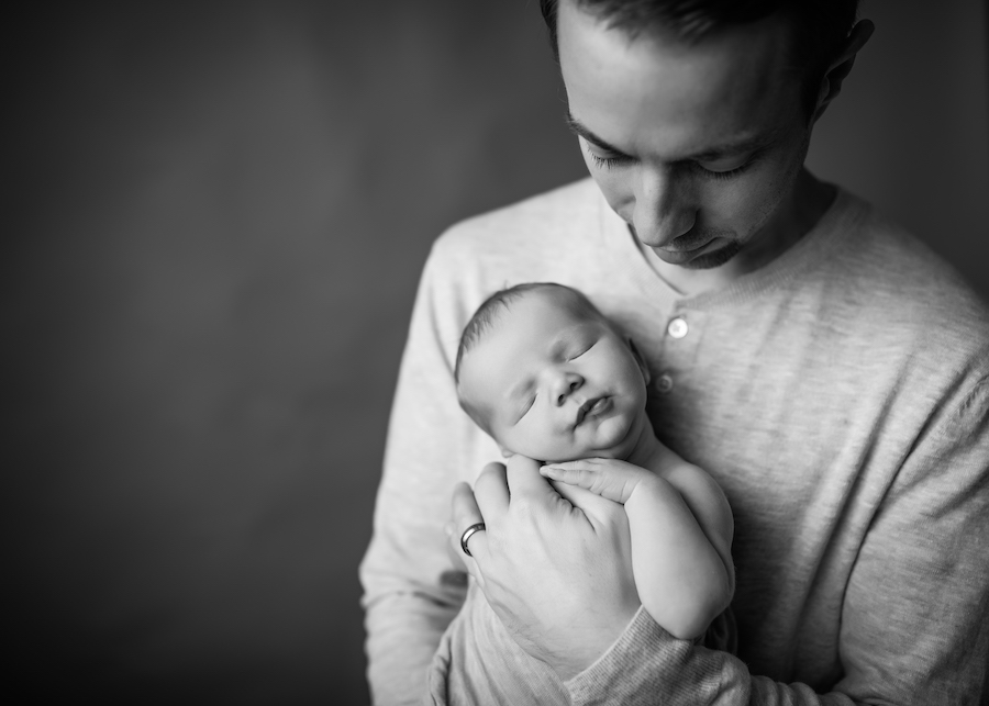 Dad holding baby Baltimore, MD