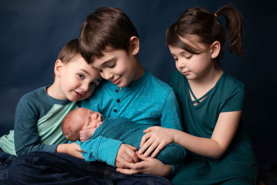 3 siblings with baby brother