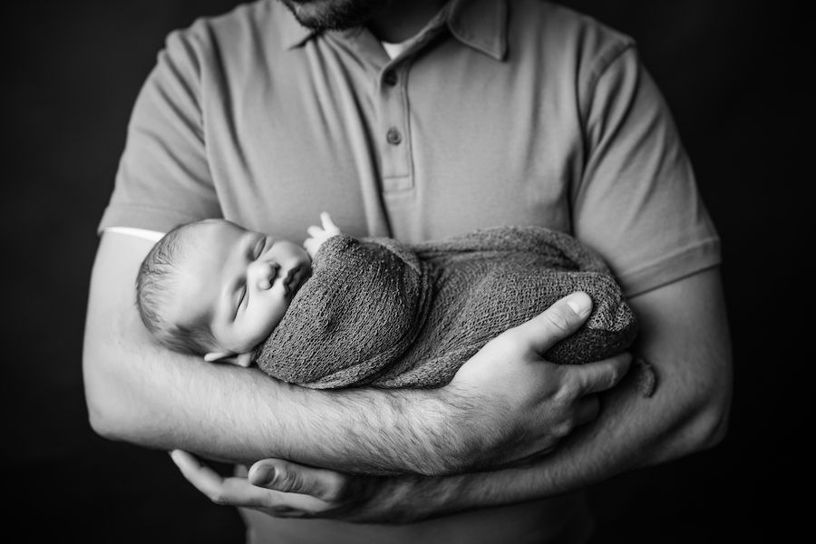 Dad holding newborn