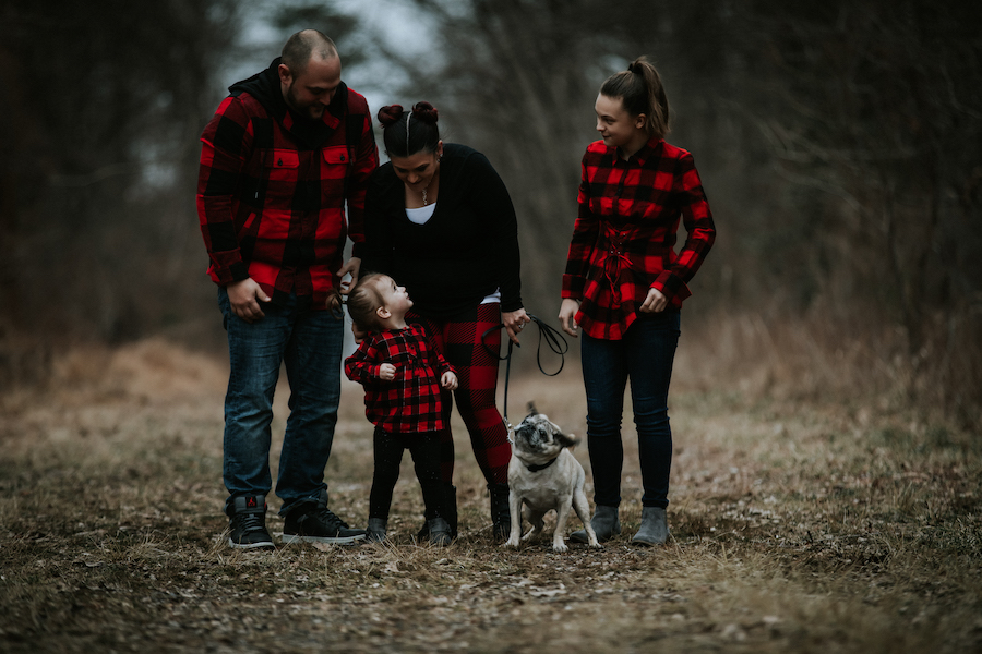 Family walking in woods