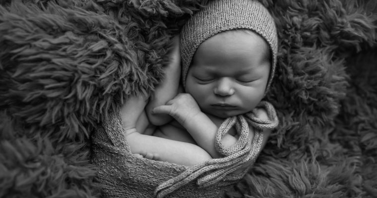 Newborn Baby Boy in Wrap with Bonnet